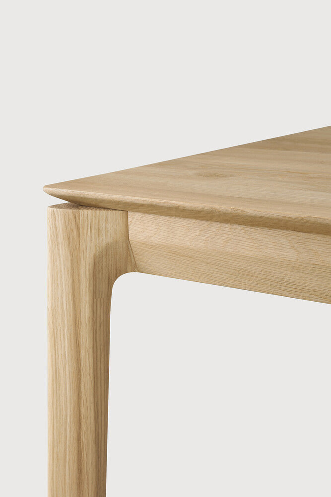 The Bok Desk by Ethnicraft features varnished oak, corner view