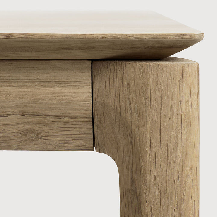 Close up of Bok Dining Table by Ethnicraft - Modern wooden dining table with natural oak finish and minimalist design