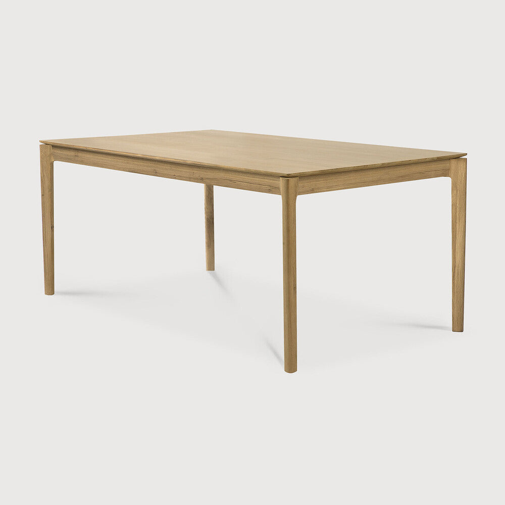 Side view of Bok Dining Table by Ethnicraft - Modern wooden dining table with natural oak finish and minimalist design